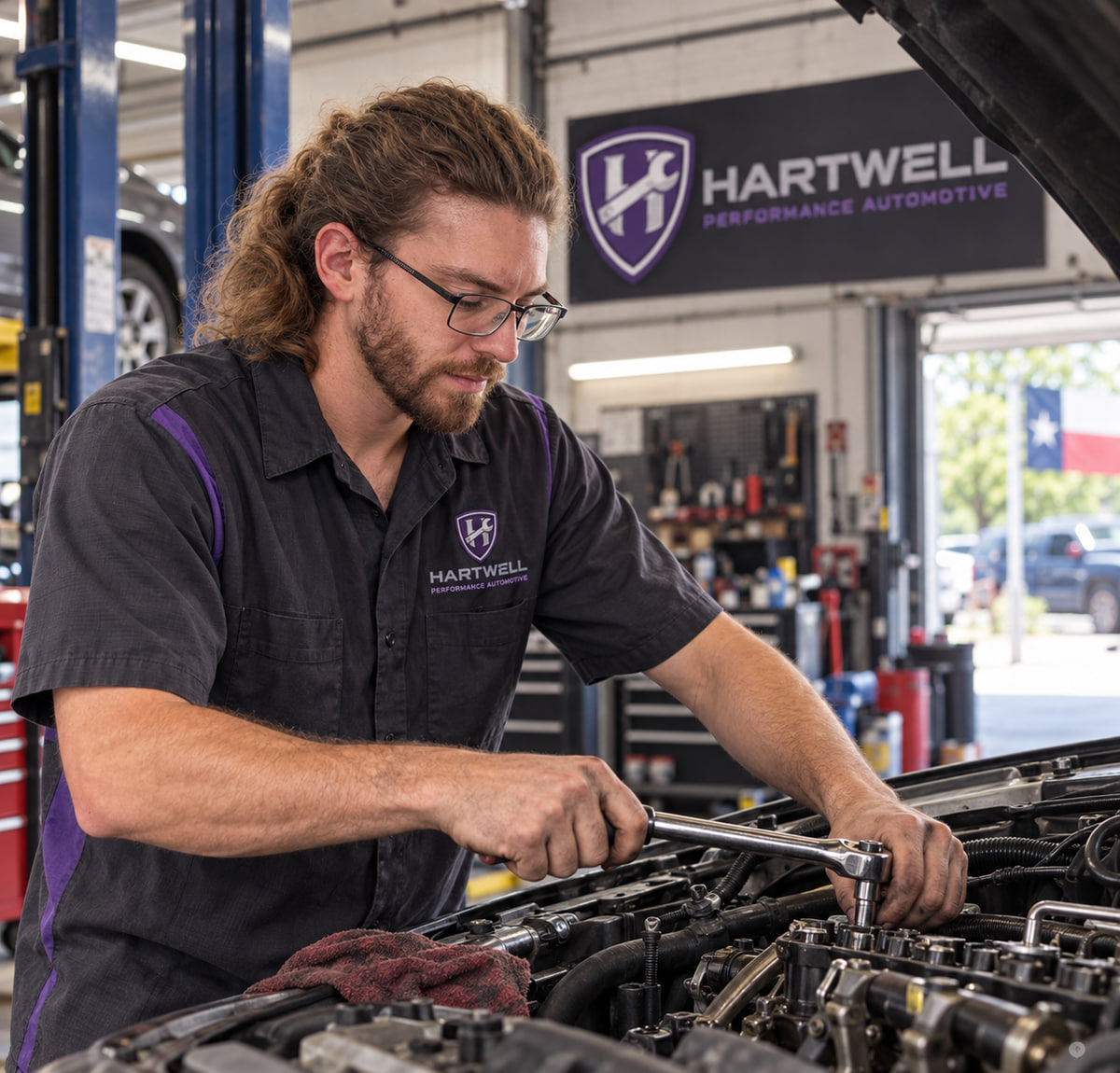 Mason Stratton, owner of Hartwell Performance Automotive, working in the repair shop in Bastrop, TX